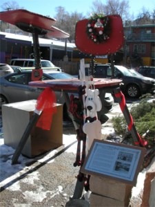Sculpture in Manitou Springs, date uncertain. At some point after 1999 the chair was painted red. Photo from the Manitou Springs Arts Council.